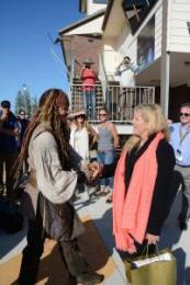 Johnny Depp receives a special welcome gift from Redland City Mayor Karen Williams in 2015. Image: Redland City Council