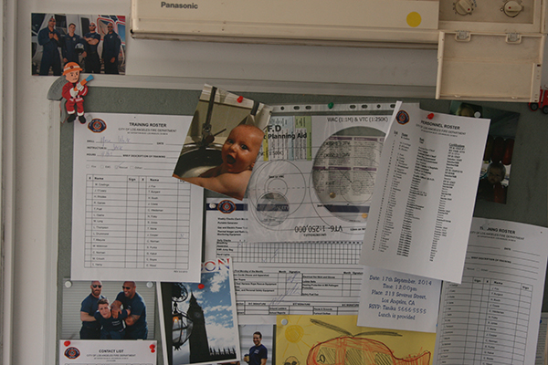 Close-up of Dwayne Johnson's notice board in the movie, complete with photos of babies and pictures of skylarking with his crew. Great attention to detail from Australian set designers.