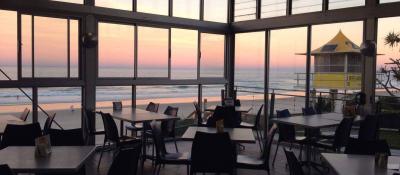 The Surf Club at Nobbys is the only place to be for sunset dining, offering spectacular views.